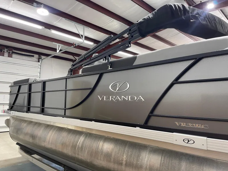 Slide: The Image of 2021 Veranda VR22RC pontoon boat in a warehouse setting. - 8