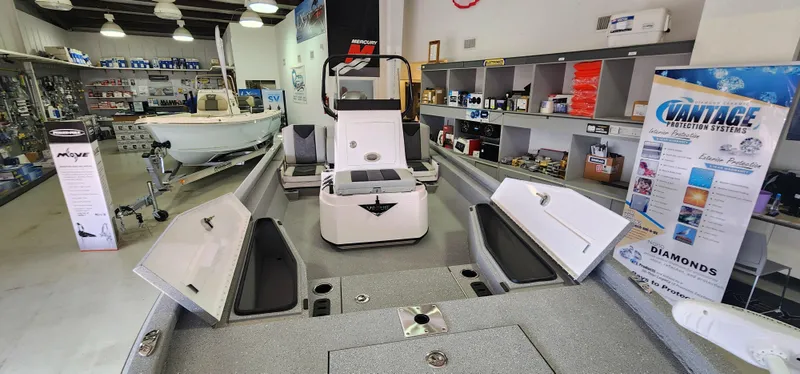 Slide: The Image of Vexus ACX2000 2025 model displayed in a showroom with open storage compartments. - 14
