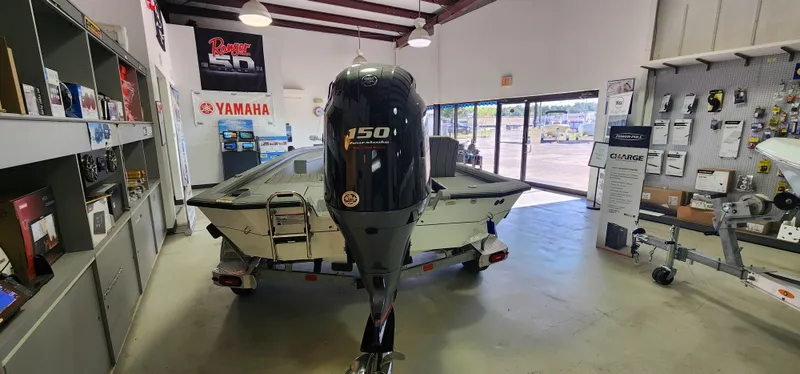 Slide: The Image of 2025 Vexus ACX2000 boat with Yamaha 150 engine displayed in a showroom. - 3