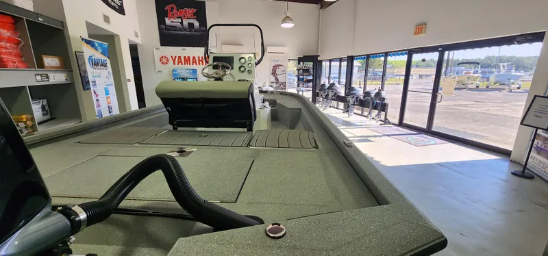 Slide: The Image of 2025 Vexus ACX2000 boat displayed in showroom with Yamaha branding. - 7