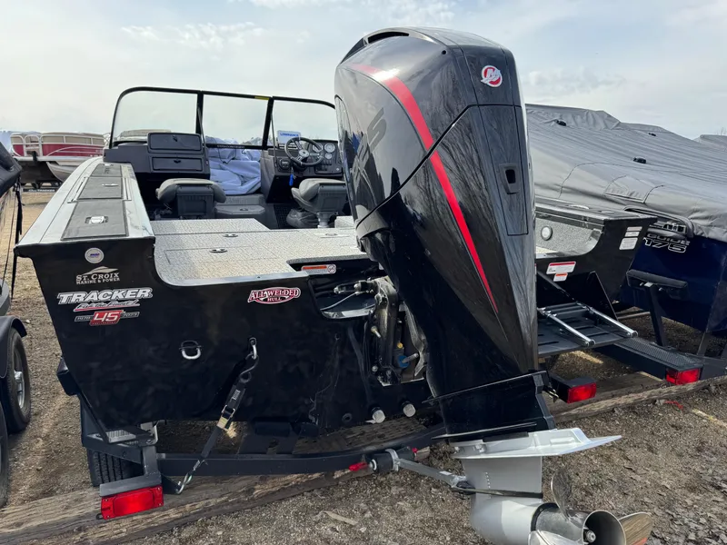 Slide: The Image of 2023 Tracker Targa V-19 WT boat with powerful outboard motor, parked outdoors. - 4