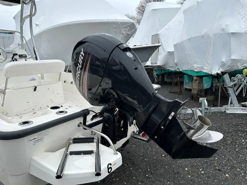Slide: The Image of Boston Whaler 190 Montauk 2015 with Mercury outboard motor in storage yard. - 2