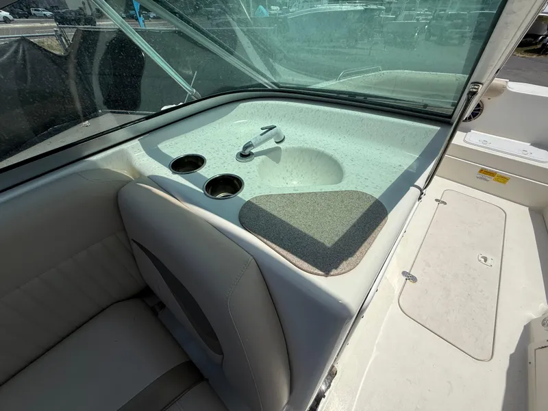 Slide: The Image of 2014 NauticStar 203DC Sport Deck interior with sink and cup holders. - 22