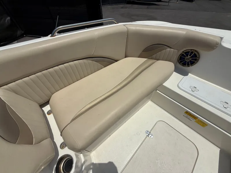 Slide: The Image of 2014 NauticStar 203DC Sport Deck boat interior with beige seating and speaker. - 28