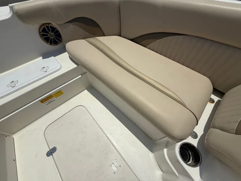 Slide: The Image of 2014 NauticStar 203DC Sport Deck boat interior with beige seating and cup holder. - 30