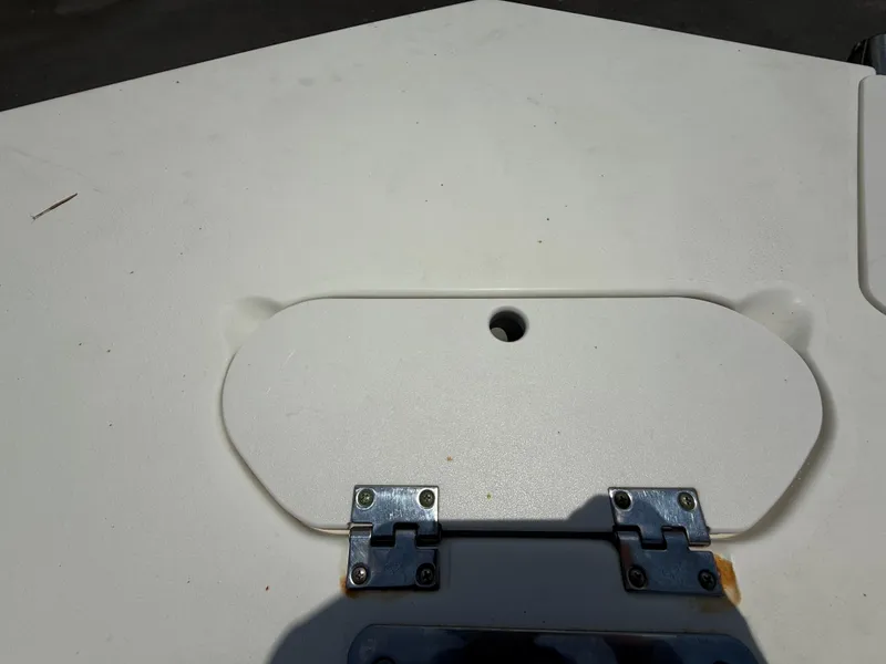 Slide: The Image of 2014 NauticStar 203DC Sport Deck boat hatch with metal hinges. - 35