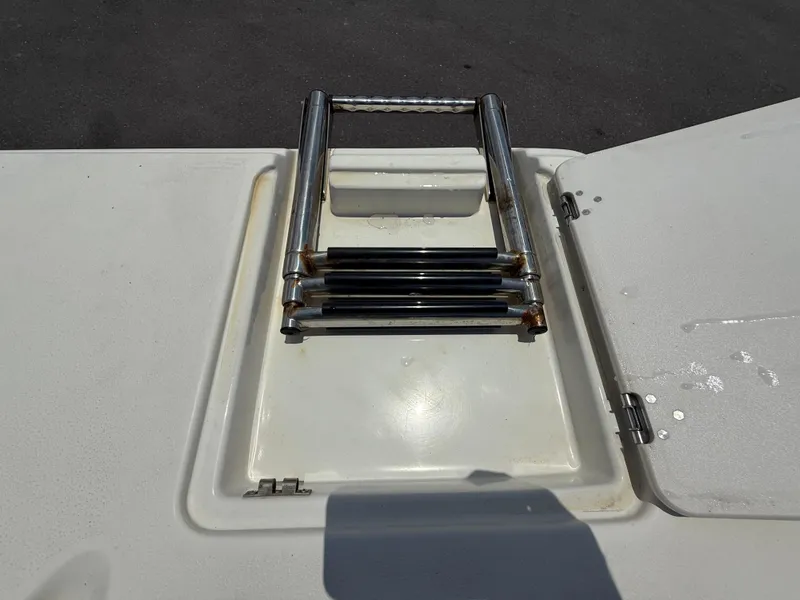 Slide: The Image of Foldable ladder on a 2014 NauticStar 203DC Sport Deck boat. - 38