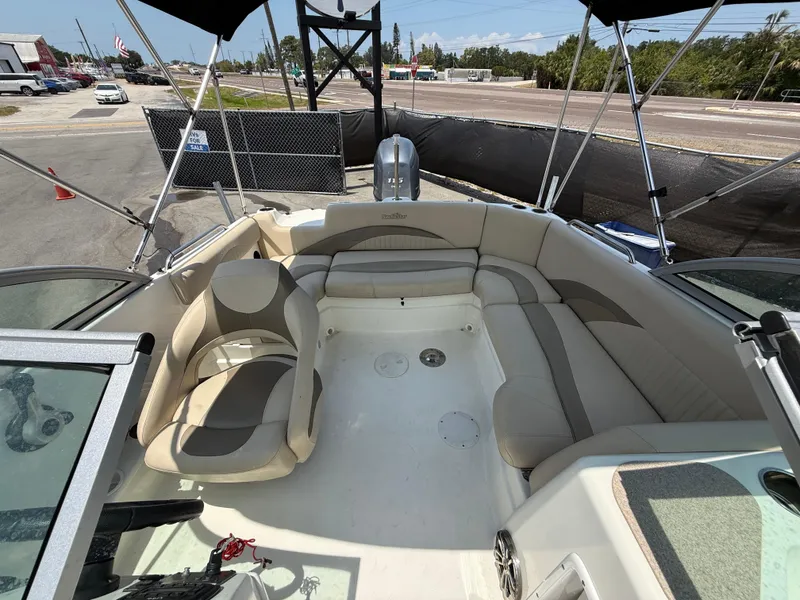 Slide: The Image of 2014 NauticStar 203DC Sport Deck boat interior with beige seating and open deck layout. - 44