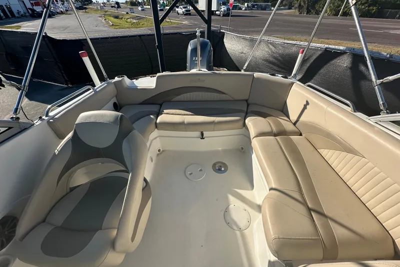 Slide: The Image of 2014 NauticStar 203DC Sport Deck boat interior with beige seating and spacious layout. - 48
