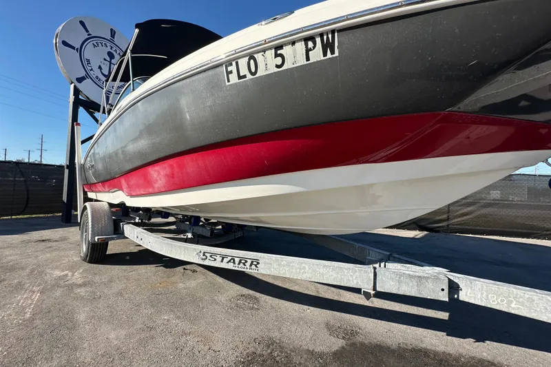 Slide: The Image of 2014 NauticStar 203DC Sport Deck boat on trailer, side view. - 6