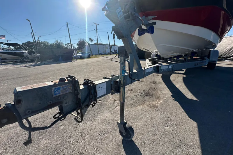 Slide: The Image of 2014 NauticStar 203DC Sport Deck on trailer under bright sunlight. - 8