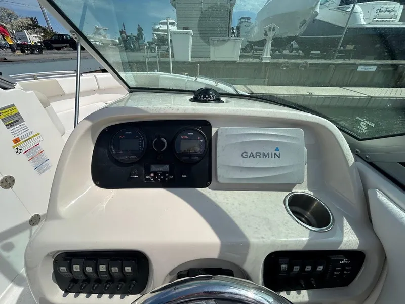 Slide: The Image of Dashboard of a 2014 Robalo R227 boat with Garmin navigation system. - 10