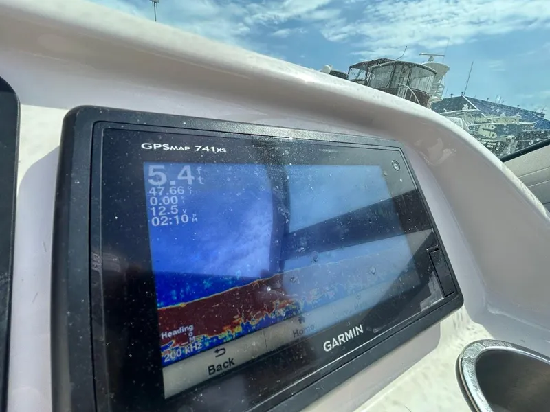 Slide: The Image of Garmin GPSMAP 741xs on 2014 Robalo R227 boat, displaying navigation data under clear skies. - 13