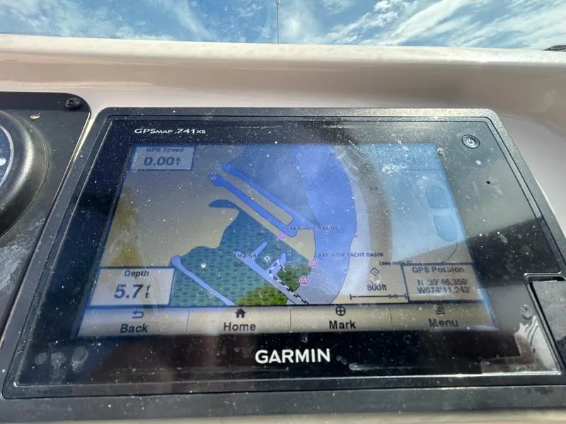 Slide: The Image of Garmin GPS display on 2014 Robalo R227 boat, showing navigation map and depth. - 14