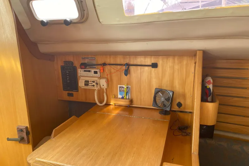 Slide: The Image of Interior of 1988 Kirie 286 sailboat with navigation station and communication equipment. - 20