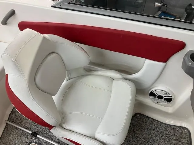 Slide: The Image of 2014 Chaparral 18 Sport H2O boat interior with white and red seating. - 12