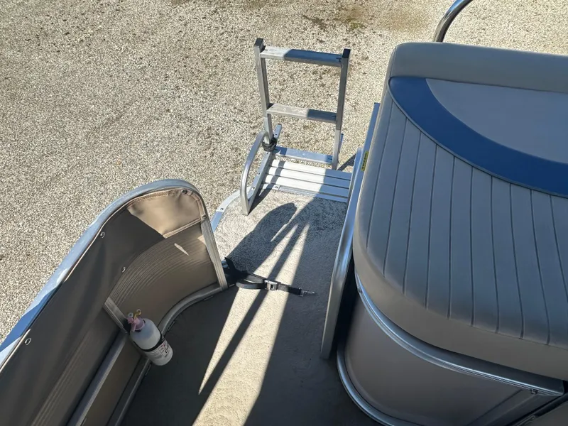 Slide: The Image of 2008 Godfrey AquaPatio 22 boat deck with ladder and seating area. - 14