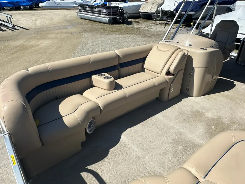 Slide: The Image of 2008 Godfrey AquaPatio 22 pontoon boat with beige seating and cup holders. - 6