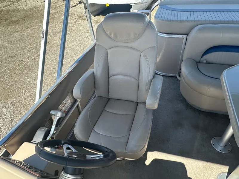 Slide: The Image of Captain's seat on 2008 Godfrey AquaPatio 22 pontoon boat, featuring plush gray upholstery. - 8