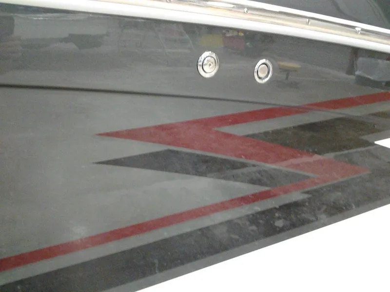 Slide: The Image of 2018 Formula 310 Bowrider with sleek black and red hull design. - 2