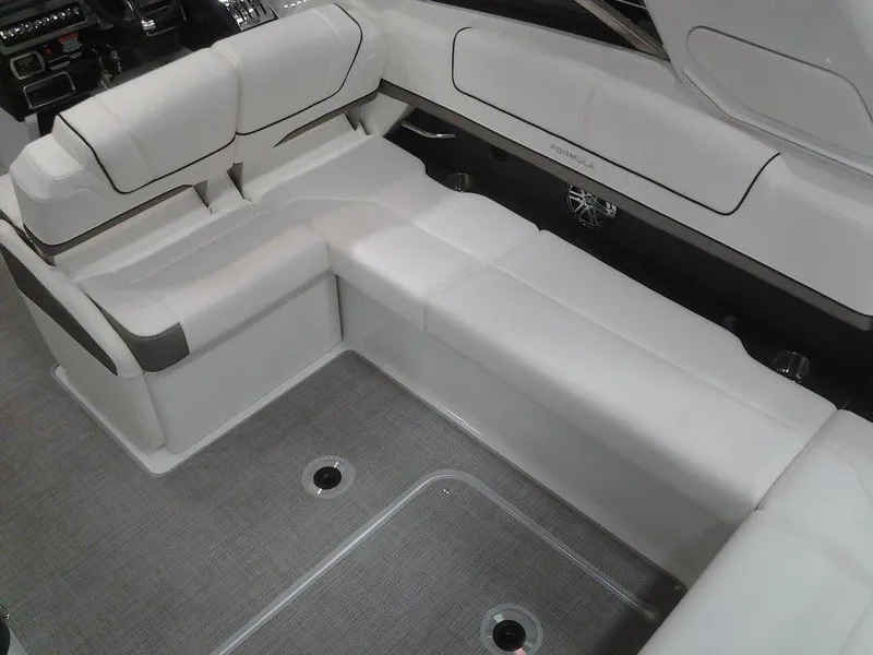 Slide: The Image of 2018 Formula 310 Bowrider interior with white seating and gray flooring. - 21