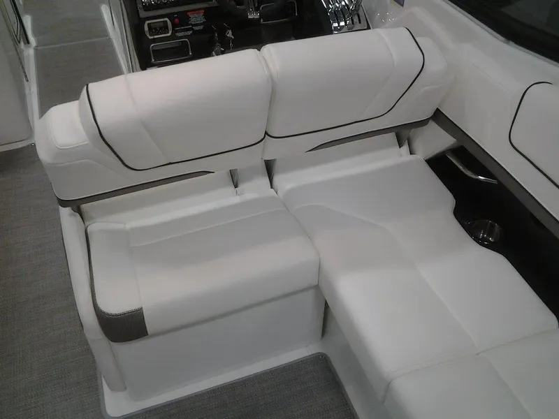 Slide: The Image of 2018 Formula 310 Bowrider interior with white cushioned seating and sleek design. - 22