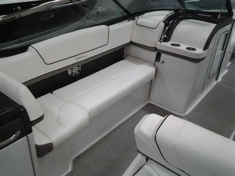 Slide: The Image of 2018 Formula 310 Bowrider interior with white seating and modern design. - 24