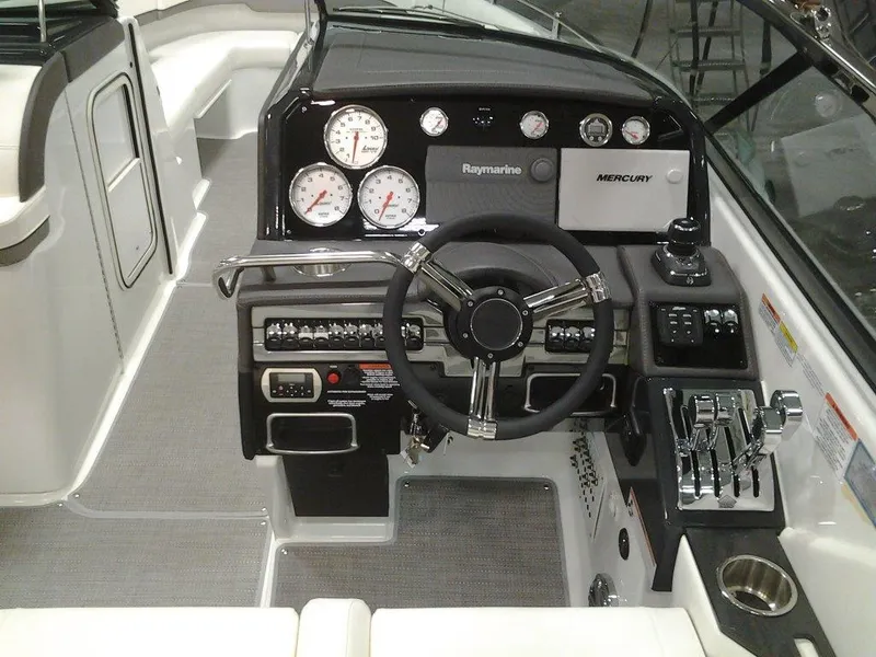 Slide: The Image of 2018 Formula 310 Bowrider dashboard with steering wheel, gauges, and controls. - 25