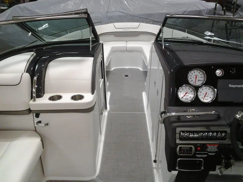 Slide: The Image of 2018 Formula 310 Bowrider interior with sleek dashboard and seating area. - 27