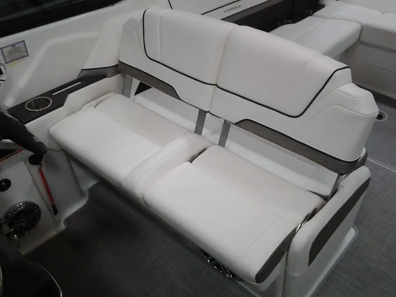 Slide: The Image of 2018 Formula 310 Bowrider interior seating with white upholstery and modern design. - 28