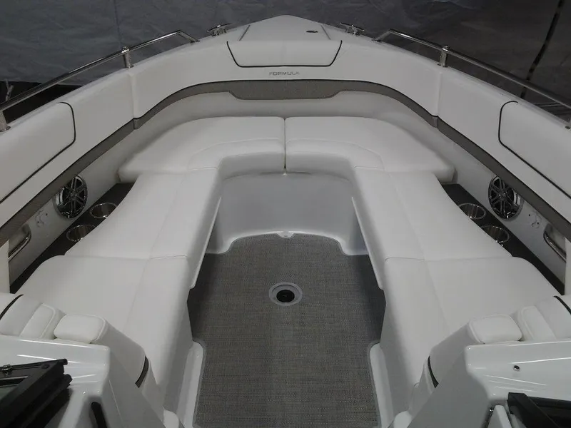 Slide: The Image of 2018 Formula 310 Bowrider interior with white seating and sleek design. - 29