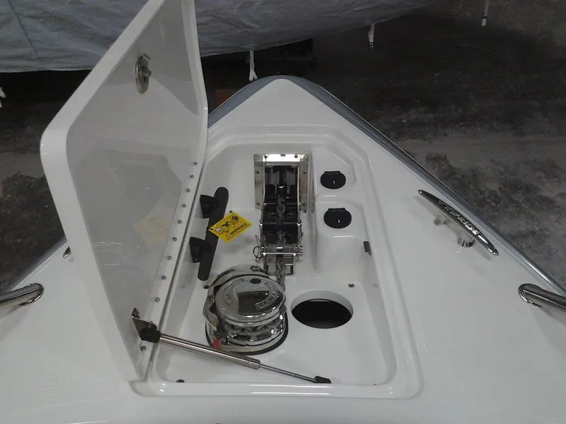 Slide: The Image of 2018 Formula 310 Bowrider anchor compartment with open hatch and winch system. - 30