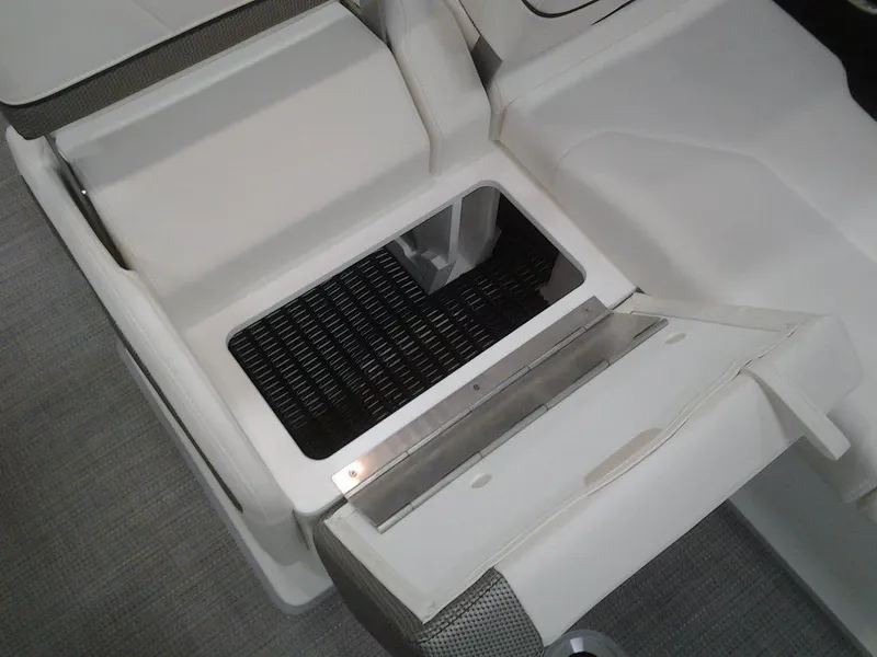 Slide: The Image of 2018 Formula 310 Bowrider storage compartment with open hatch, showcasing interior design. - 36