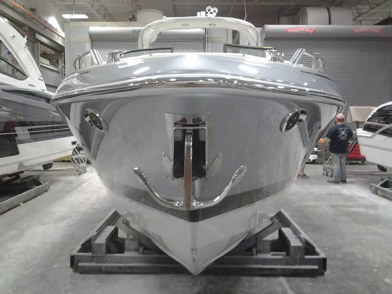 Slide: The Image of 2018 Formula 310 Bowrider boat in a showroom, front view. - 8