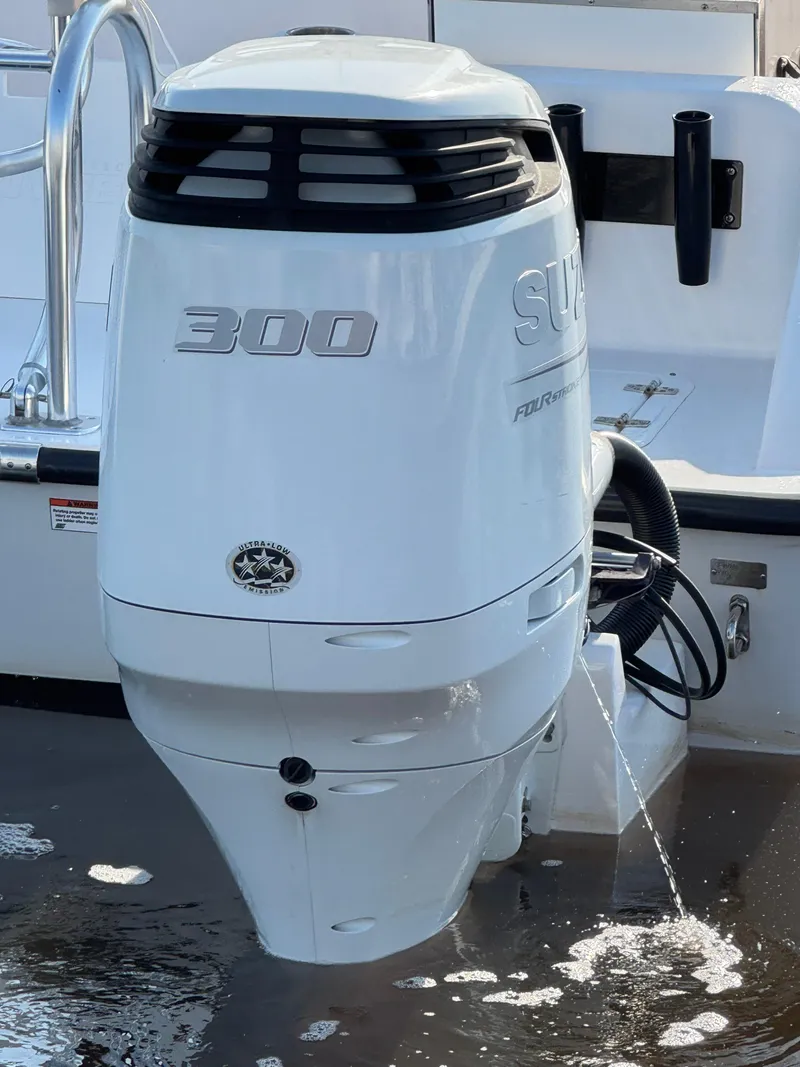 Slide: The Image of 2023 Twin Vee 280 GFX CC boat with powerful outboard motor in water. - 10