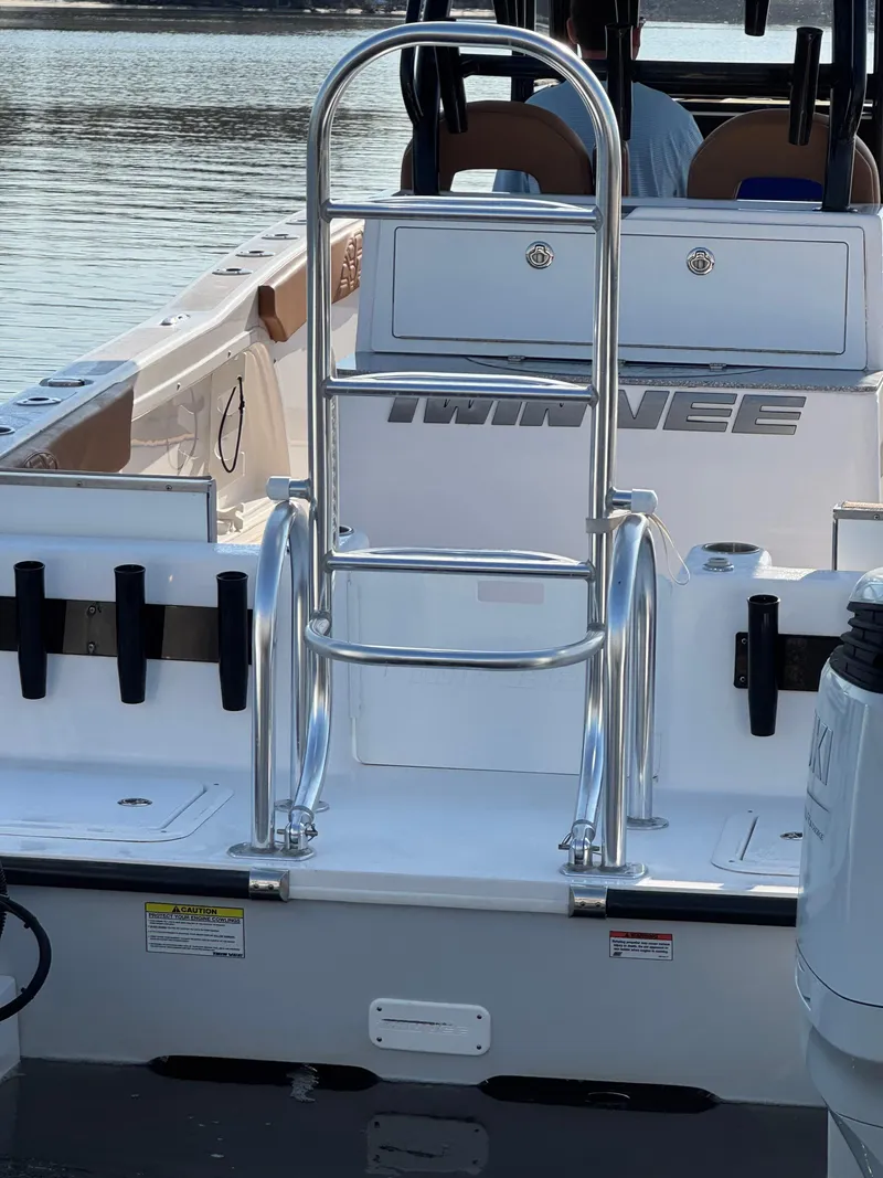 Slide: The Image of 2023 Twin Vee 280 GFX CC boat with stainless steel ladder and spacious deck. - 13