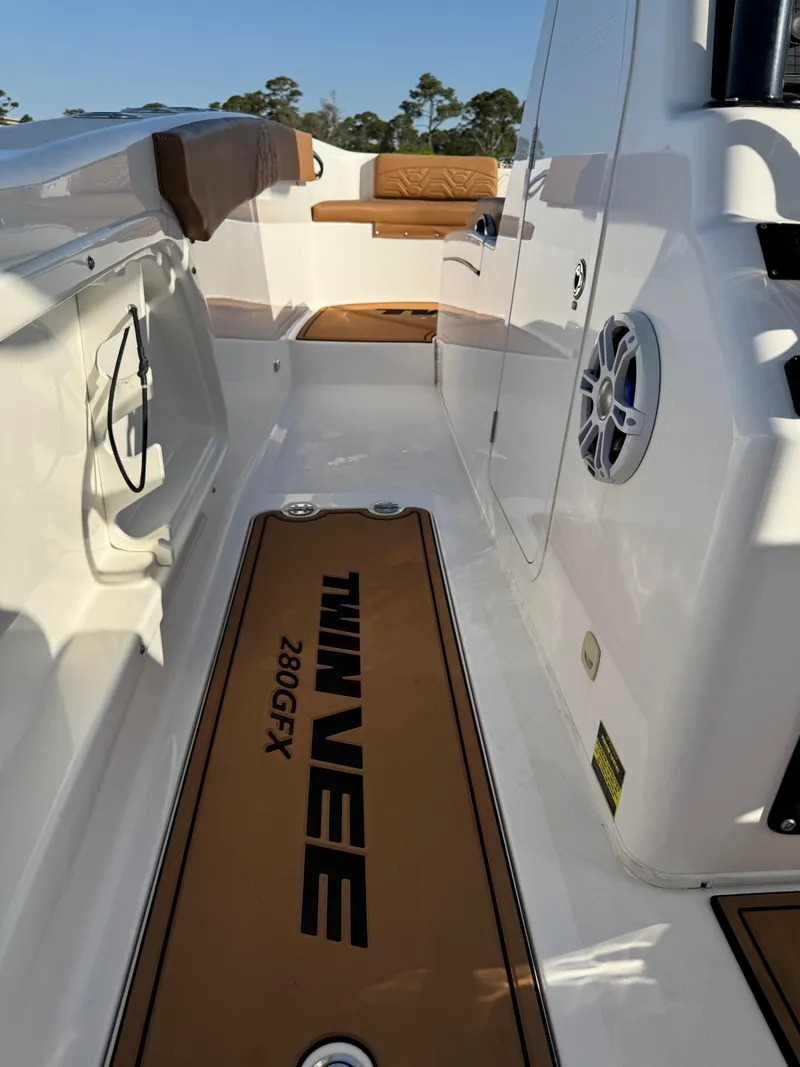 Slide: The Image of 2023 Twin Vee 280 GFX CC boat interior with seating and speaker. - 15