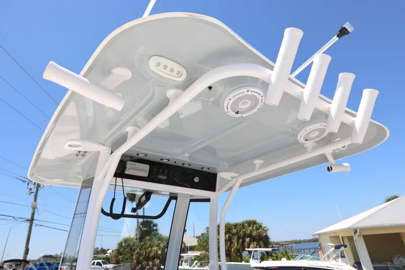 Slide: The Image of 2025 Sea Hunt Gamefish 27 boat's T-top with rod holders and speakers. - 12