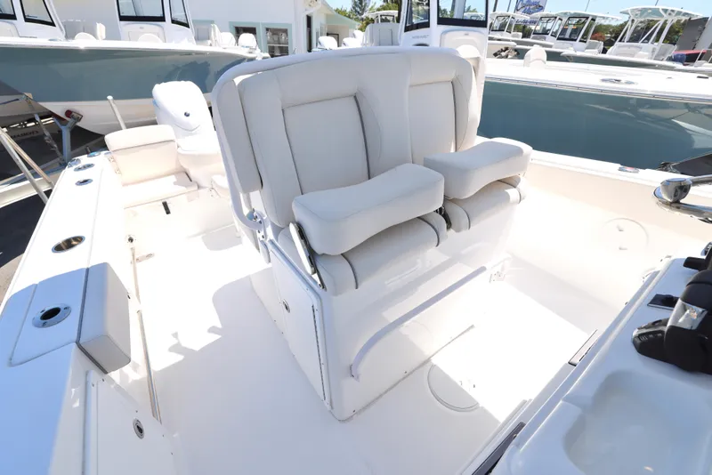 Slide: The Image of 2025 Sea Hunt Gamefish 27 Forward Seating with plush white seats and spacious deck layout. - 13