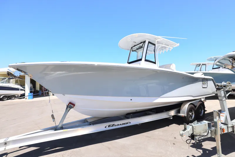 Slide: The Image of 2025 Sea Hunt Gamefish 27 Forward Seating boat on trailer, side view. - 9