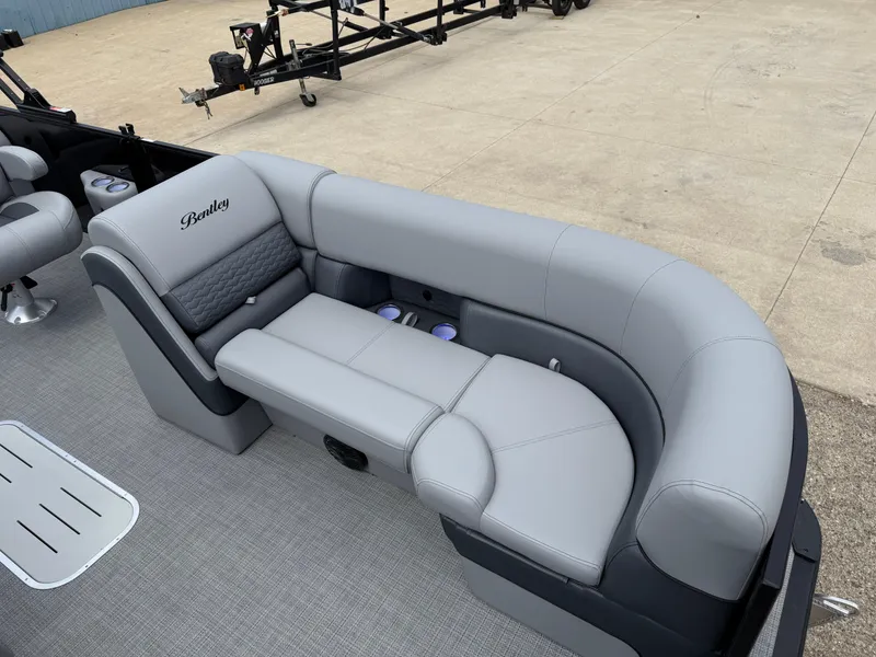 Slide: The Image of 2025 Bentley Pontoons Elite 223 Swingback Triple Log, luxurious gray seating detail. - 14
