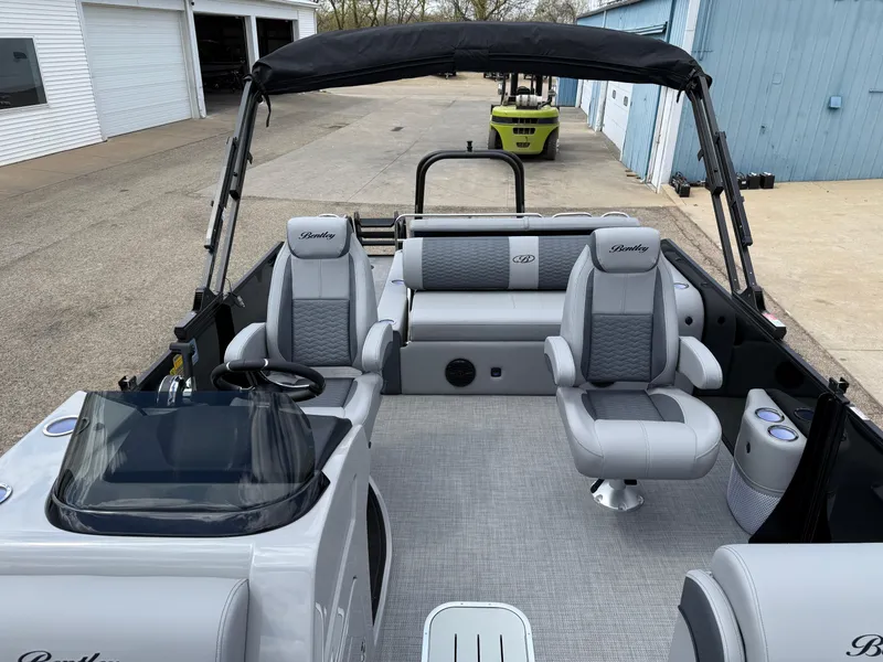 Slide: The Image of 2025 Bentley Pontoons Elite 223 Swingback Triple Log interior with luxurious seating and modern design. - 15