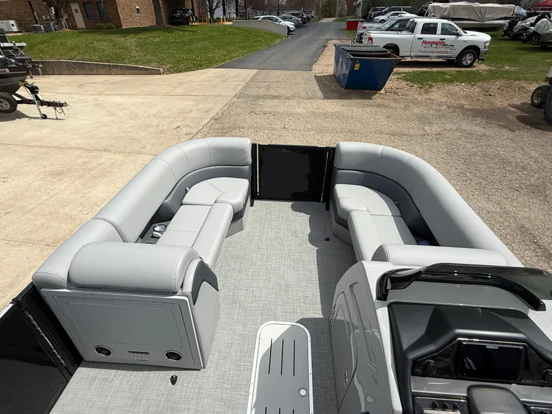 Slide: The Image of 2025 Bentley Pontoons Elite 223 Swingback Triple Log with spacious seating and modern design. - 18