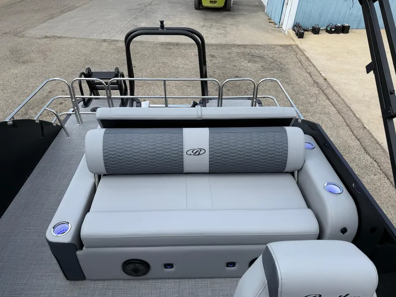 Slide: The Image of 2025 Bentley Pontoons Elite 223 Swingback Triple Log with luxurious seating and modern design. - 21