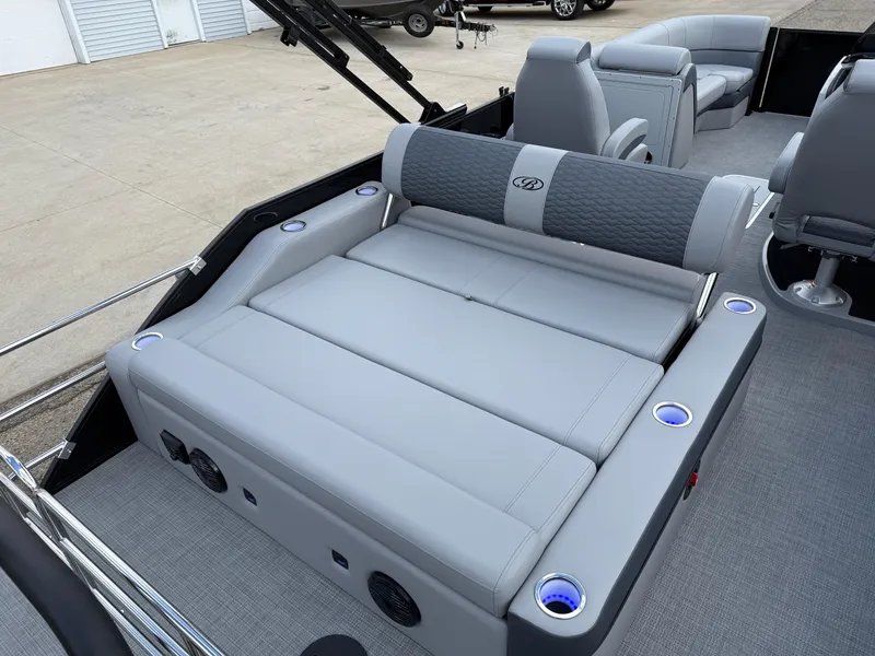 Slide: The Image of 2025 Bentley Pontoons Elite 223 Swingback Triple Log interior with luxurious seating and cup holders. - 25