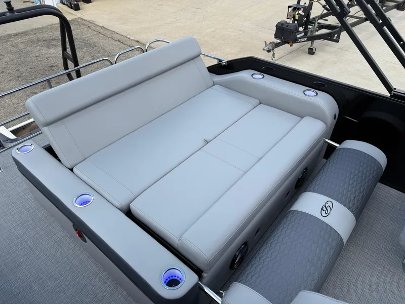 Slide: The Image of 2025 Bentley Pontoons Elite 223 Swingback Triple Log with luxurious seating and cup holders. - 26