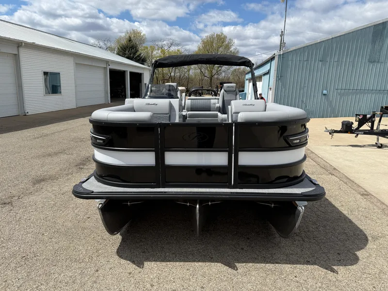 Slide: The Image of 2025 Bentley Pontoons Elite 223 Swingback Triple Log, black and white, parked outdoors. - 3