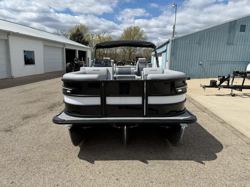 Slide: The Image of 2025 Bentley Pontoons Elite 223 Swingback Triple Log, black and white, parked outdoors. - 4