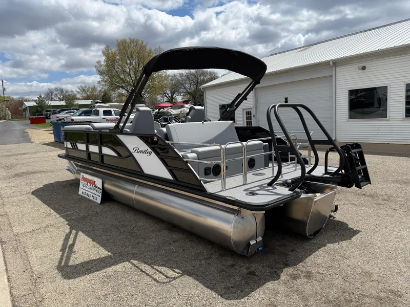 Slide: The Image of 2025 Bentley Pontoons Elite 223 Swingback Triple Log pontoon boat parked outdoors. - 9