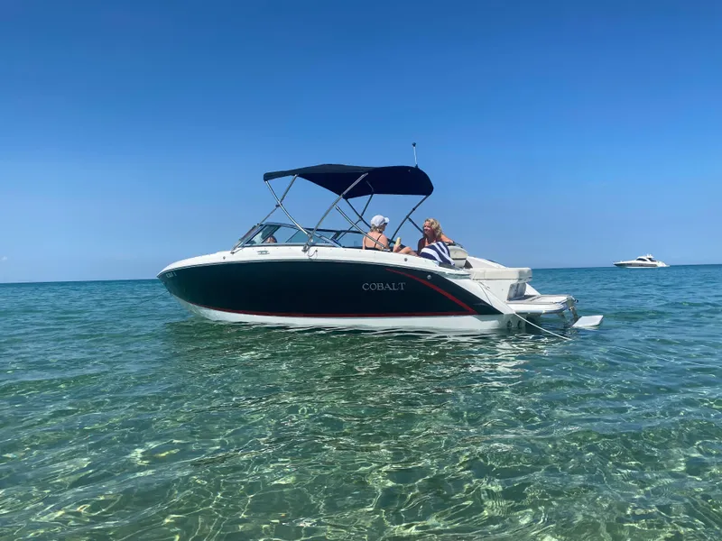 Slide: The Image of 2018 Cobalt R3 boat on clear water under blue sky. - 2